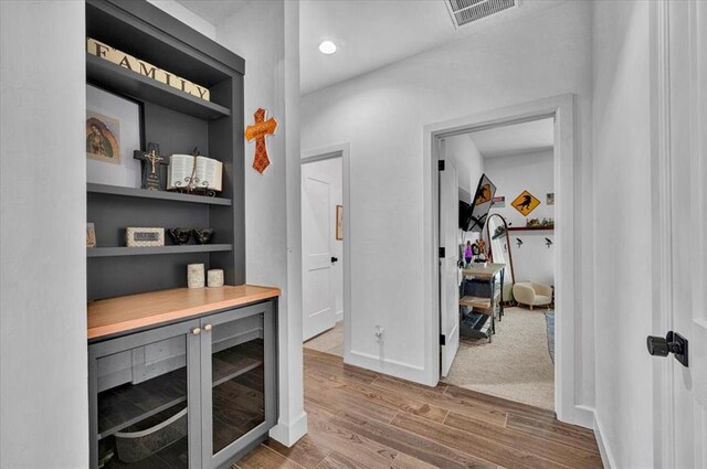 1049 Dorsi Way, Newcastle, OK 73065 - bar area with wood finished floors, built in features, baseboards, and wine cooler