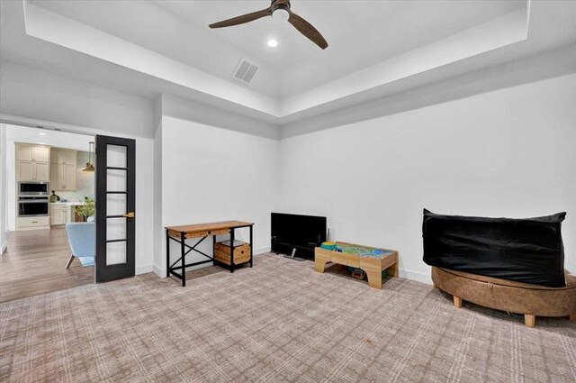 1049 Dorsi Way, Newcastle, OK 73065 - rec room with a raised ceiling, baseboards, ceiling fan, recessed lighting, and light carpet