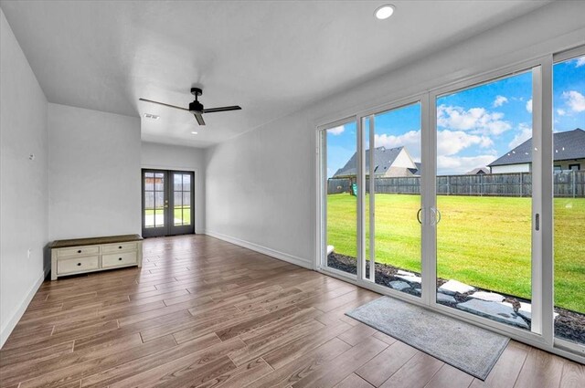 1049 Dorsi Way, Newcastle, OK 73065 - unfurnished room featuring wood finished floors, a ceiling fan, french doors, baseboards, and recessed lighting