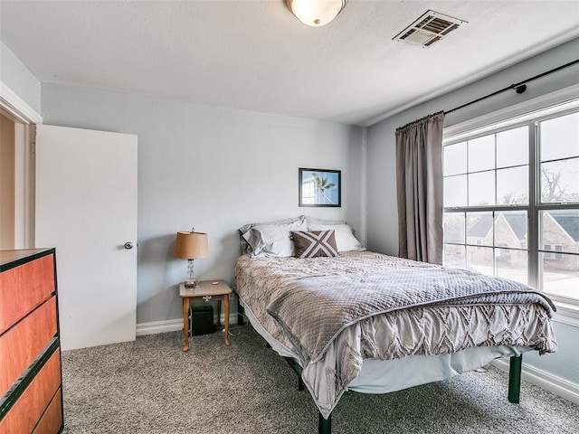 2647 NW 24th St, Oklahoma City, OK 73107 - bedroom featuring carpet flooring and multiple windows