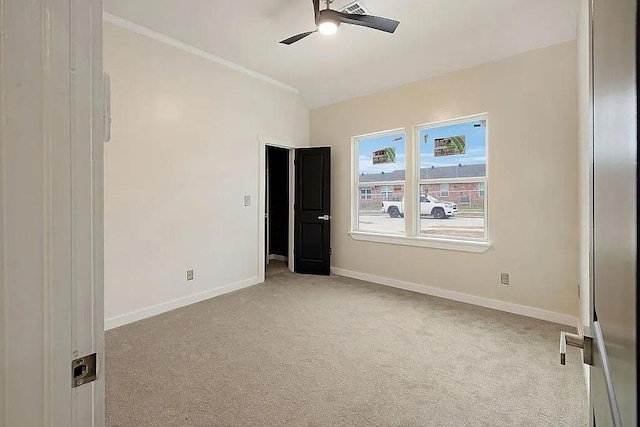 1533 NE 26th St, Oklahoma City, OK 73111 - unfurnished room with a ceiling fan, light colored carpet, and ornamental molding