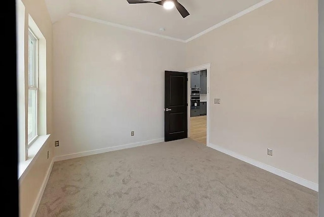 1533 NE 26th St, Oklahoma City, OK 73111 - carpeted empty room with a ceiling fan, ornamental molding, and vaulted ceiling