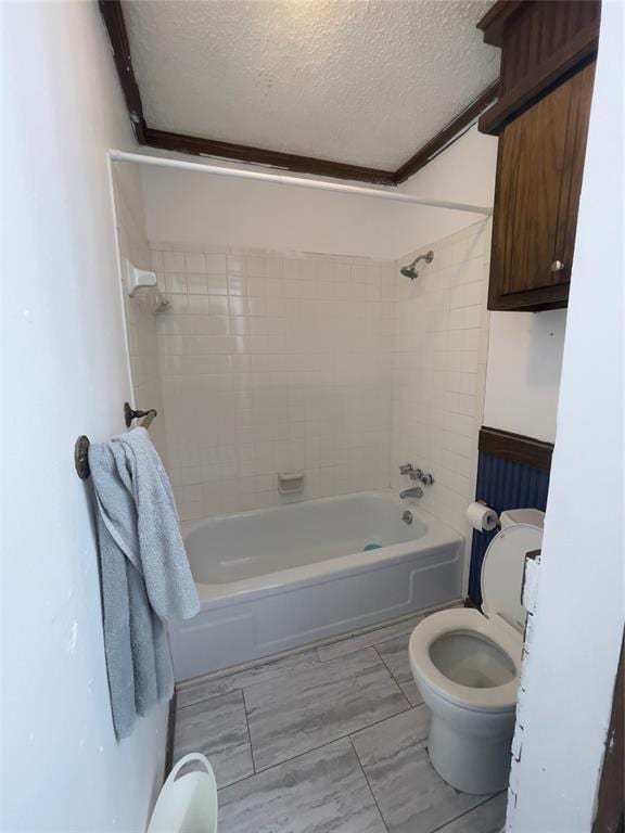 8228 NW 90th Ter, Oklahoma City, OK 73132 - bathroom with a textured ceiling and washtub / shower combination