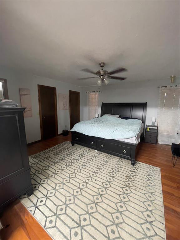 8228 NW 90th Ter, Oklahoma City, OK 73132 - bedroom with light wood-type flooring and ceiling fan