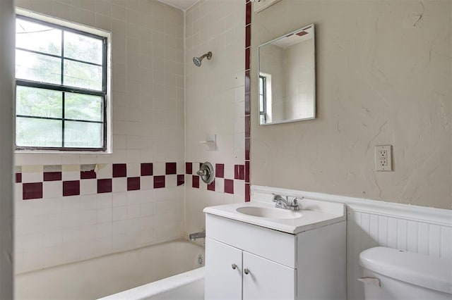 4110 SE 11th St, Oklahoma City, OK 73115 - bathroom with vanity, bathtub / shower combination, and wainscoting