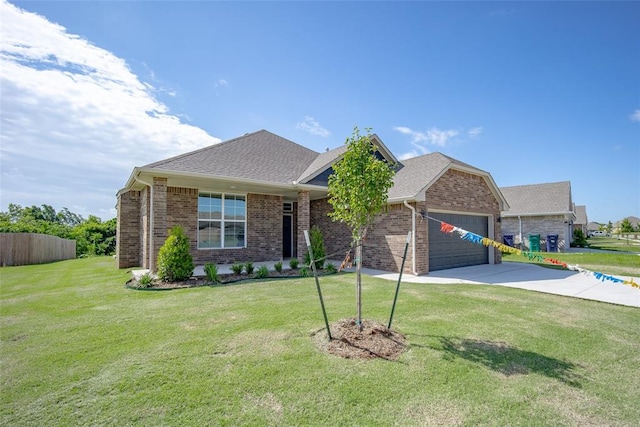 14128 Hamlet Way, Piedmont, OK 73078 - view of front of home with an attached garage, concrete driveway, brick siding, and roof with shingles