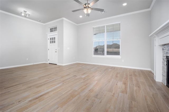 14128 Hamlet Way, Piedmont, OK 73078 - unfurnished living room featuring ceiling fan, light wood-style floors, a stone fireplace, crown molding, and baseboards
