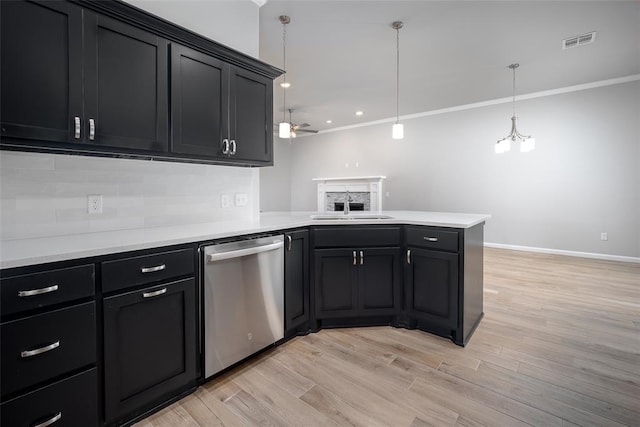 14128 Hamlet Way, Piedmont, OK 73078 - kitchen featuring dishwasher, a sink, a peninsula, backsplash, and light countertops