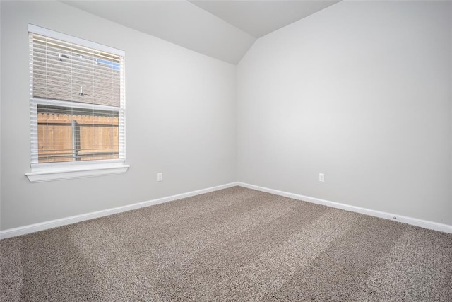 14128 Hamlet Way, Piedmont, OK 73078 - carpeted empty room featuring vaulted ceiling, healthy amount of natural light, and baseboards