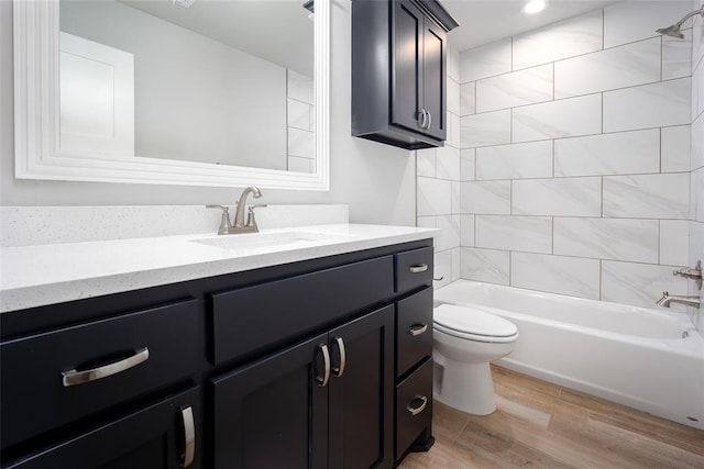 14128 Hamlet Way, Piedmont, OK 73078 - full bathroom with vanity, wood finished floors, toilet, and shower / washtub combination