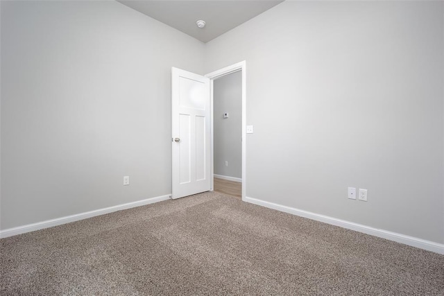 14128 Hamlet Way, Piedmont, OK 73078 - spare room featuring carpet floors, baseboards, and a smoke detector