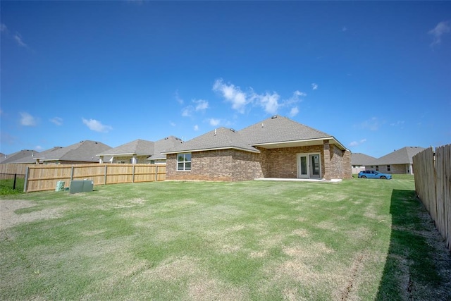 14128 Hamlet Way, Piedmont, OK 73078 - back of property featuring french doors and brick siding