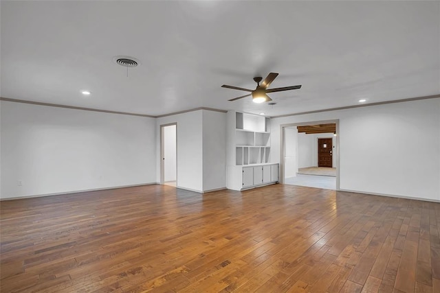 1048 Elk St, Altus, OK 73521 - unfurnished living room with ceiling fan, hardwood / wood-style flooring, crown molding, and recessed lighting
