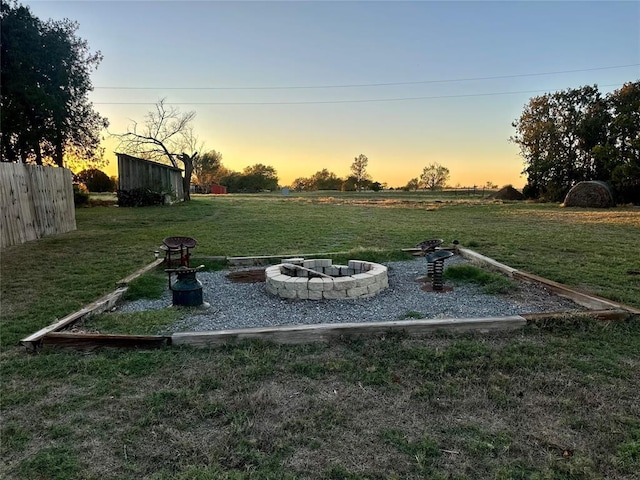 20973 US Highway 62, Altus, OK 73521 - yard at dusk with an outdoor fire pit