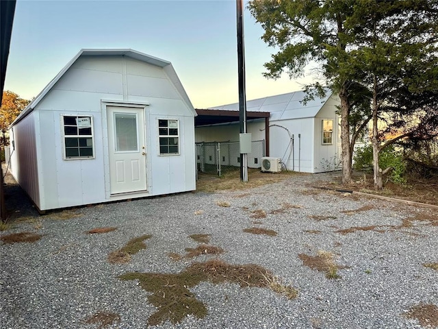 20973 US Highway 62, Altus, OK 73521 - outdoor structure at dusk featuring a cooling unit and a storage shed