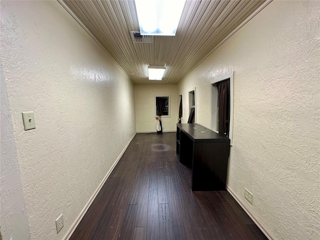 20973 US Highway 62, Altus, OK 73521 - corridor with a textured wall, baseboards, dark wood finished floors, and wooden ceiling