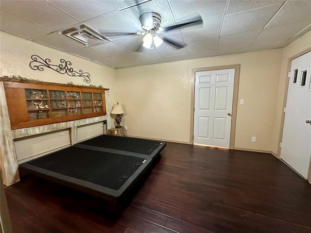 20973 US Highway 62, Altus, OK 73521 - workout area featuring wood finished floors, a paneled ceiling, and a ceiling fan