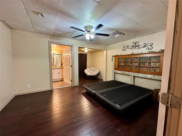 20973 US Highway 62, Altus, OK 73521 - exercise room with a ceiling fan, a drop ceiling, hardwood / wood-style floors, and baseboards