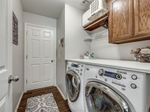 1816 Concord Pl, Norman, OK 73071 - laundry room featuring washing machine and dryer, baseboards, dark wood-type flooring, and cabinet space