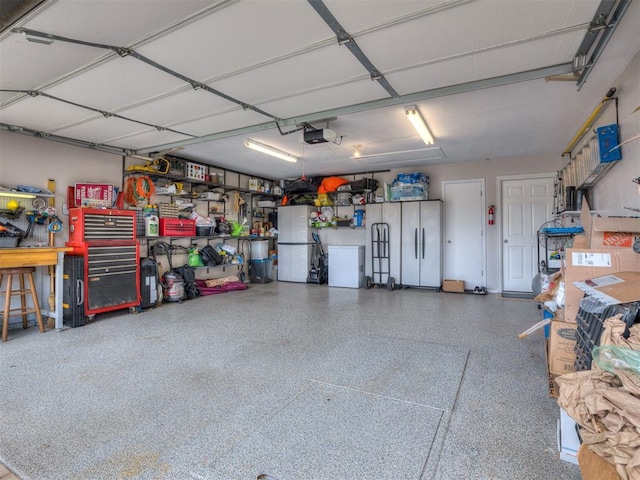 1816 Concord Pl, Norman, OK 73071 - garage with freestanding refrigerator and a garage door opener