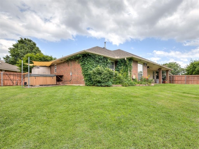 1816 Concord Pl, Norman, OK 73071 - rear view of property featuring a hot tub, brick siding, and ceiling fan