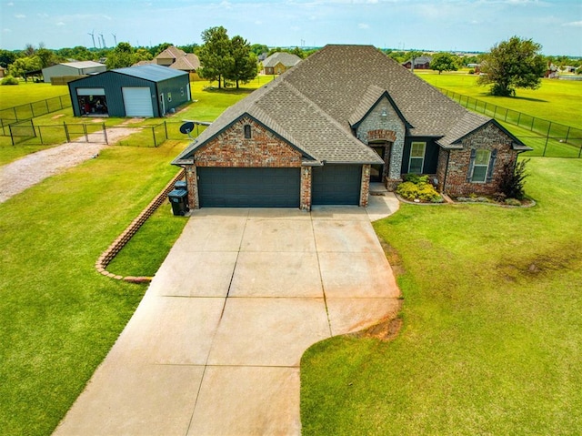 866 County St Unit 2922, Tuttle, OK 73089 - view of front facade featuring concrete driveway, brick siding, an attached garage, and roof with shingles