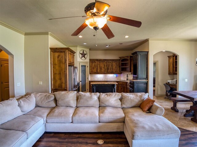 866 County St Unit 2922, Tuttle, OK 73089 - living area with arched walkways, ornamental molding, ceiling fan, and recessed lighting