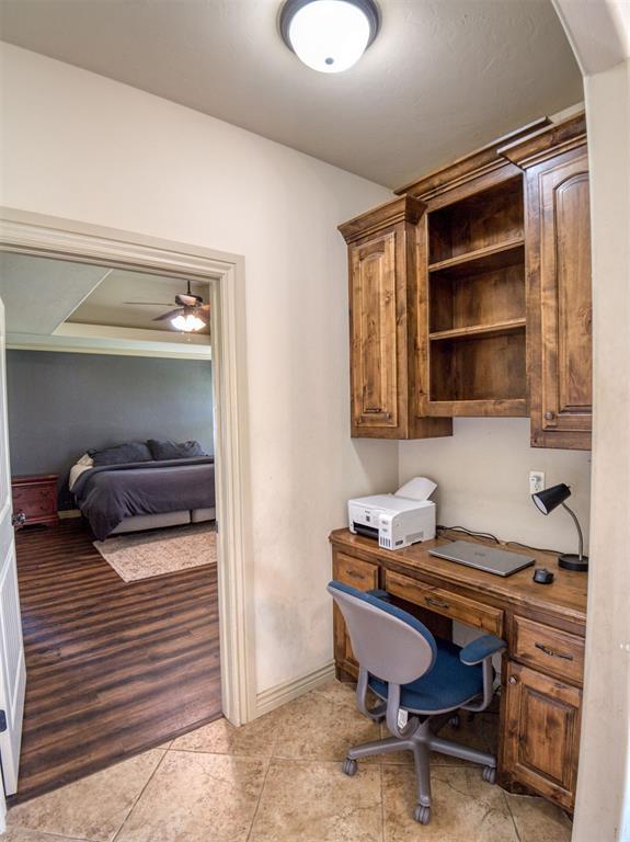 866 County St Unit 2922, Tuttle, OK 73089 - office space featuring ceiling fan, light tile patterned floors, baseboards, and arched walkways