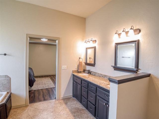 866 County St Unit 2922, Tuttle, OK 73089 - full bathroom featuring double vanity, a garden tub, tile patterned floors, and connected bathroom