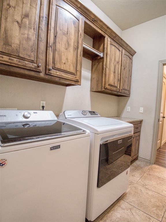 866 County St Unit 2922, Tuttle, OK 73089 - laundry room featuring separate washer and dryer and cabinet space