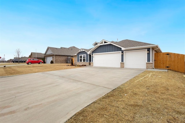 1208 Ariana St, Shawnee, OK 74804 - ranch-style house featuring an attached garage, board and batten siding, driveway, and brick siding