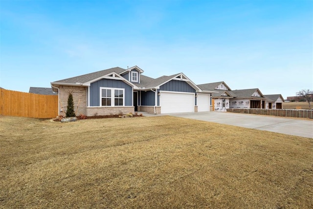 1208 Ariana St, Shawnee, OK 74804 - view of front facade featuring board and batten siding, a garage, concrete driveway, brick siding, and roof with shingles