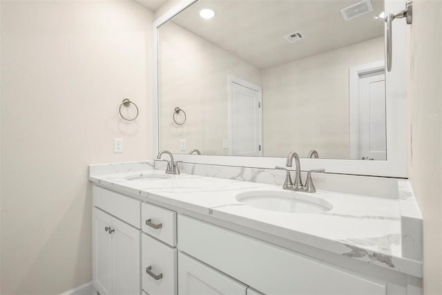 1208 Ariana St, Shawnee, OK 74804 - bathroom featuring double vanity and recessed lighting