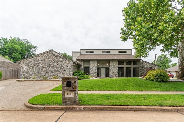 4208 Briarcrest St, Norman, OK 73072 - mid-century home with stone siding and driveway