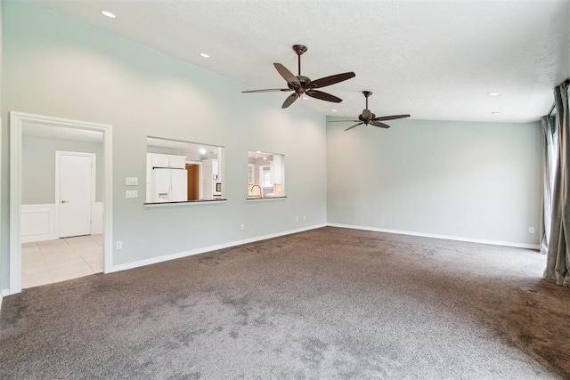 4208 Briarcrest St, Norman, OK 73072 - unfurnished living room with carpet flooring, ceiling fan, recessed lighting, and high vaulted ceiling