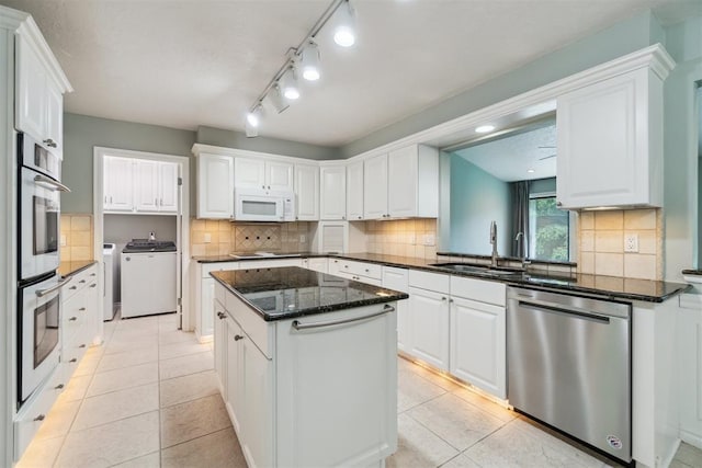4208 Briarcrest St, Norman, OK 73072 - kitchen with appliances with stainless steel finishes, a center island, and white cabinets