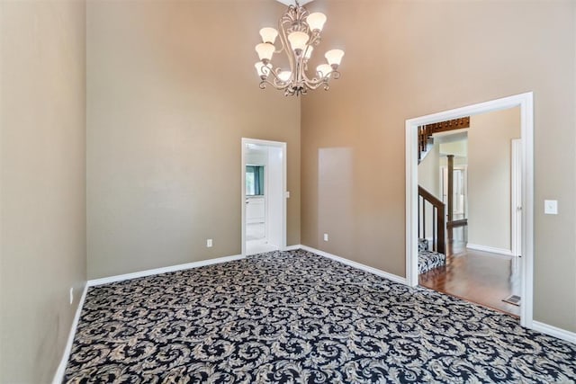 4208 Briarcrest St, Norman, OK 73072 - carpeted empty room featuring a chandelier and a towering ceiling