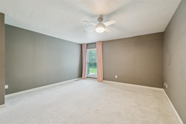 4208 Briarcrest St, Norman, OK 73072 - unfurnished room with ceiling fan, carpet, and a textured ceiling