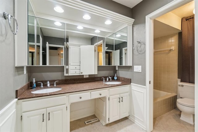 4208 Briarcrest St, Norman, OK 73072 - bathroom featuring double vanity, tile patterned flooring, bathing tub / shower combination, and recessed lighting