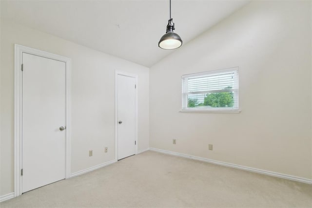 4208 Briarcrest St, Norman, OK 73072 - unfurnished bedroom with light colored carpet and vaulted ceiling