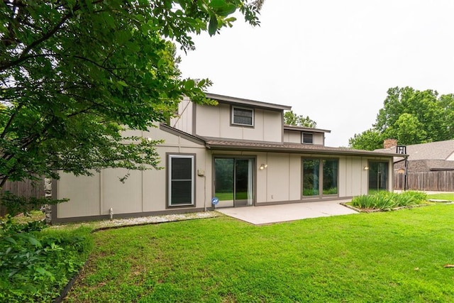 4208 Briarcrest St, Norman, OK 73072 - back of house featuring a patio area, board and batten siding, and a chimney