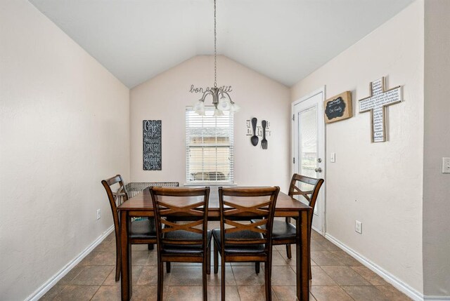 2365 Turtlewood River Rd, Midwest City, OK 73130 - dining space featuring a chandelier, vaulted ceiling, and baseboards