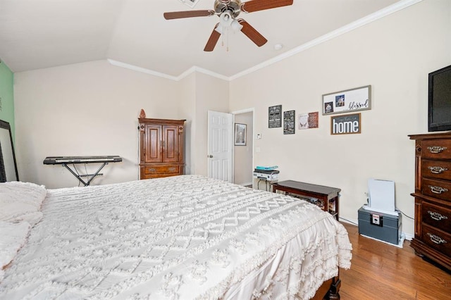 2365 Turtlewood River Rd, Midwest City, OK 73130 - bedroom featuring wood finished floors, crown molding, vaulted ceiling, baseboards, and a ceiling fan