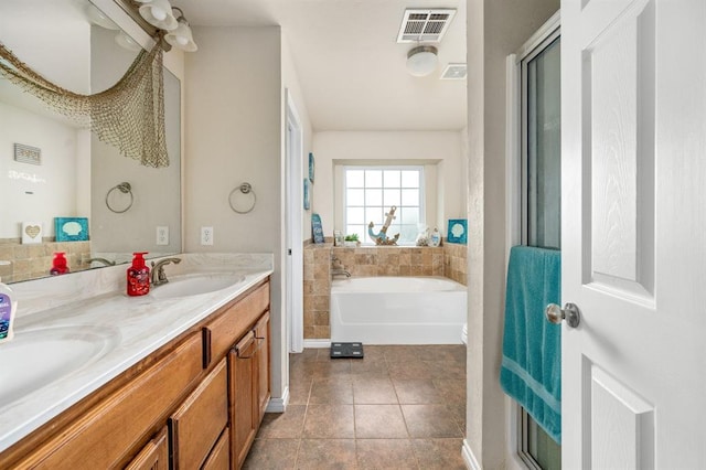 2365 Turtlewood River Rd, Midwest City, OK 73130 - bathroom featuring a bath, double vanity, and tile patterned flooring