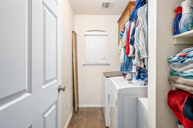 2365 Turtlewood River Rd, Midwest City, OK 73130 - washroom featuring washer and clothes dryer, cabinet space, baseboards, and dark tile patterned flooring