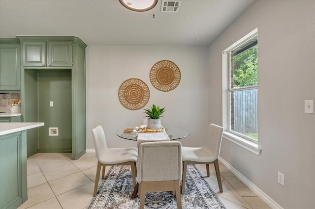 2309 NW 157th Ter, Edmond, OK 73013 - dining area with light tile patterned floors and baseboards