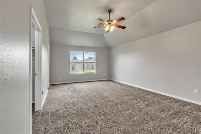 2309 NW 157th Ter, Edmond, OK 73013 - spare room with a ceiling fan, carpet flooring, baseboards, and vaulted ceiling