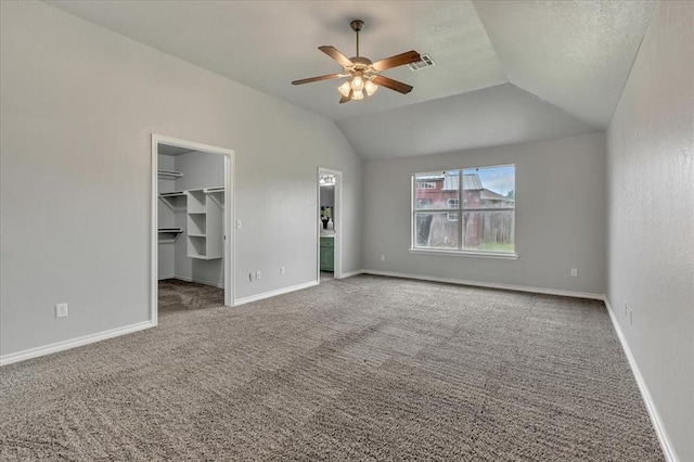 2309 NW 157th Ter, Edmond, OK 73013 - unfurnished bedroom with carpet, a spacious closet, lofted ceiling, baseboards, and a closet