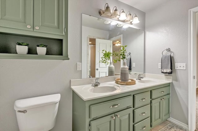2309 NW 157th Ter, Edmond, OK 73013 - bathroom featuring toilet and double vanity