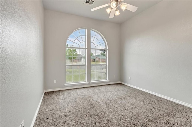 2309 NW 157th Ter, Edmond, OK 73013 - carpeted spare room featuring a ceiling fan, baseboards, and a textured wall